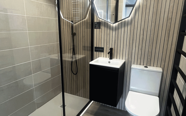 Contemporary bathroom display featuring stylish wood panels.